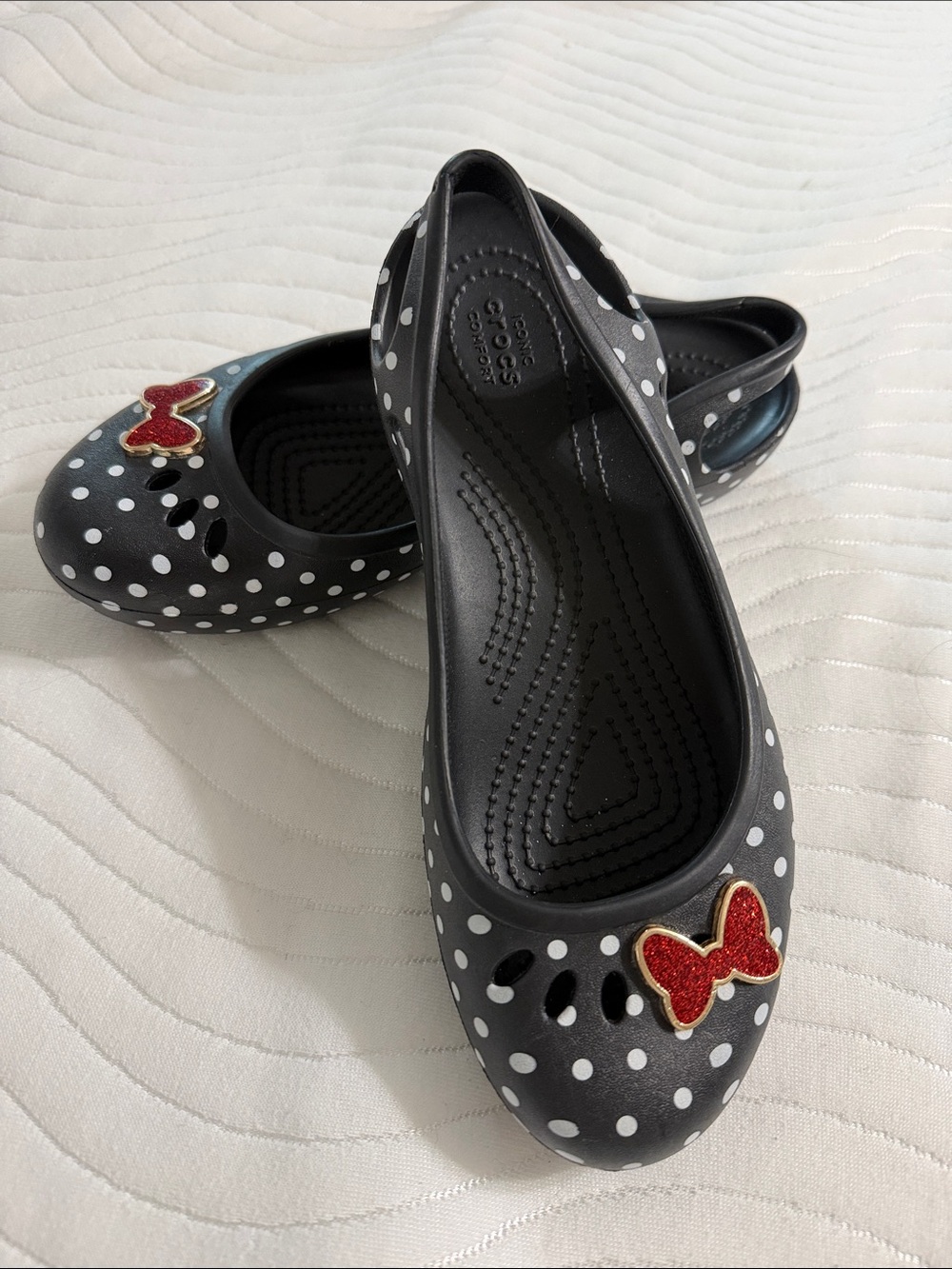 Crocs black & white polkadot flats with red bow. Women’s size 6